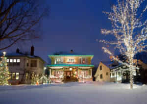 Christmas lights on house and tree