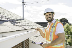 man conducting roof inspection